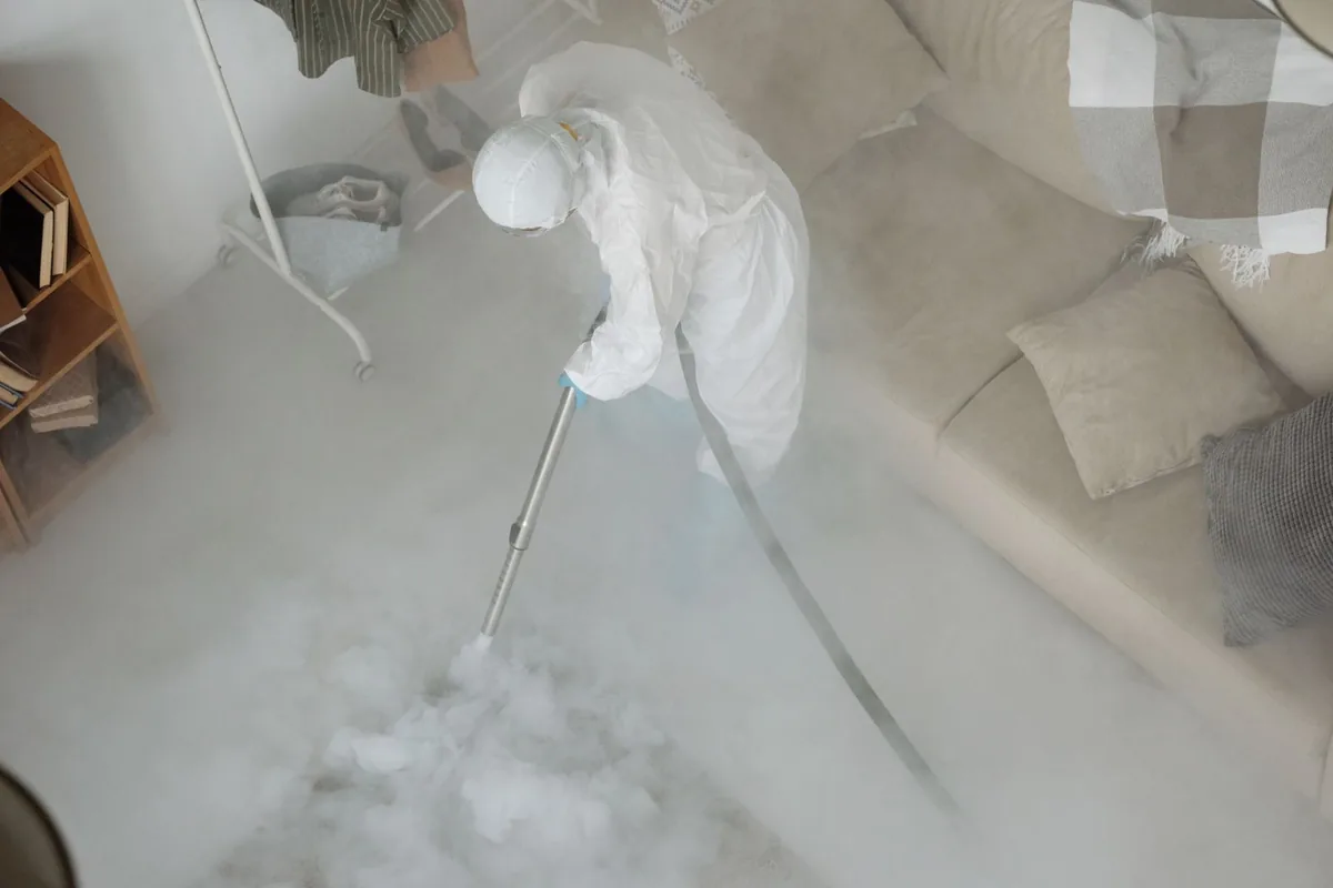 Biohazard cleanup technician in protective equipment, Juneau city and, AK